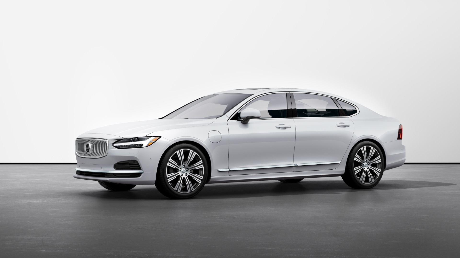 A white Volvo S90 Recharge against a white backdrop.