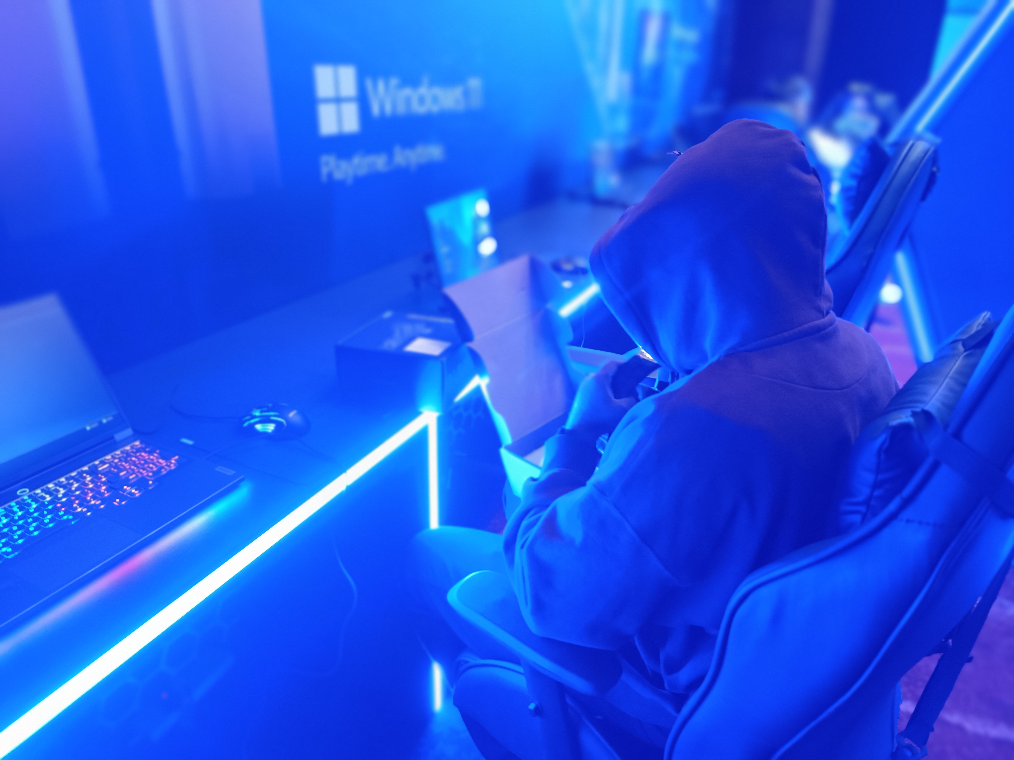Gamer wearing dak colored hoodie captured by Redmi Note 12 Pro Plus.