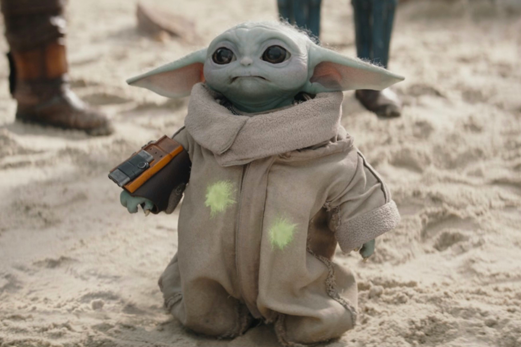 Grogu standing in the sand from an episode of The Mandalorian.
