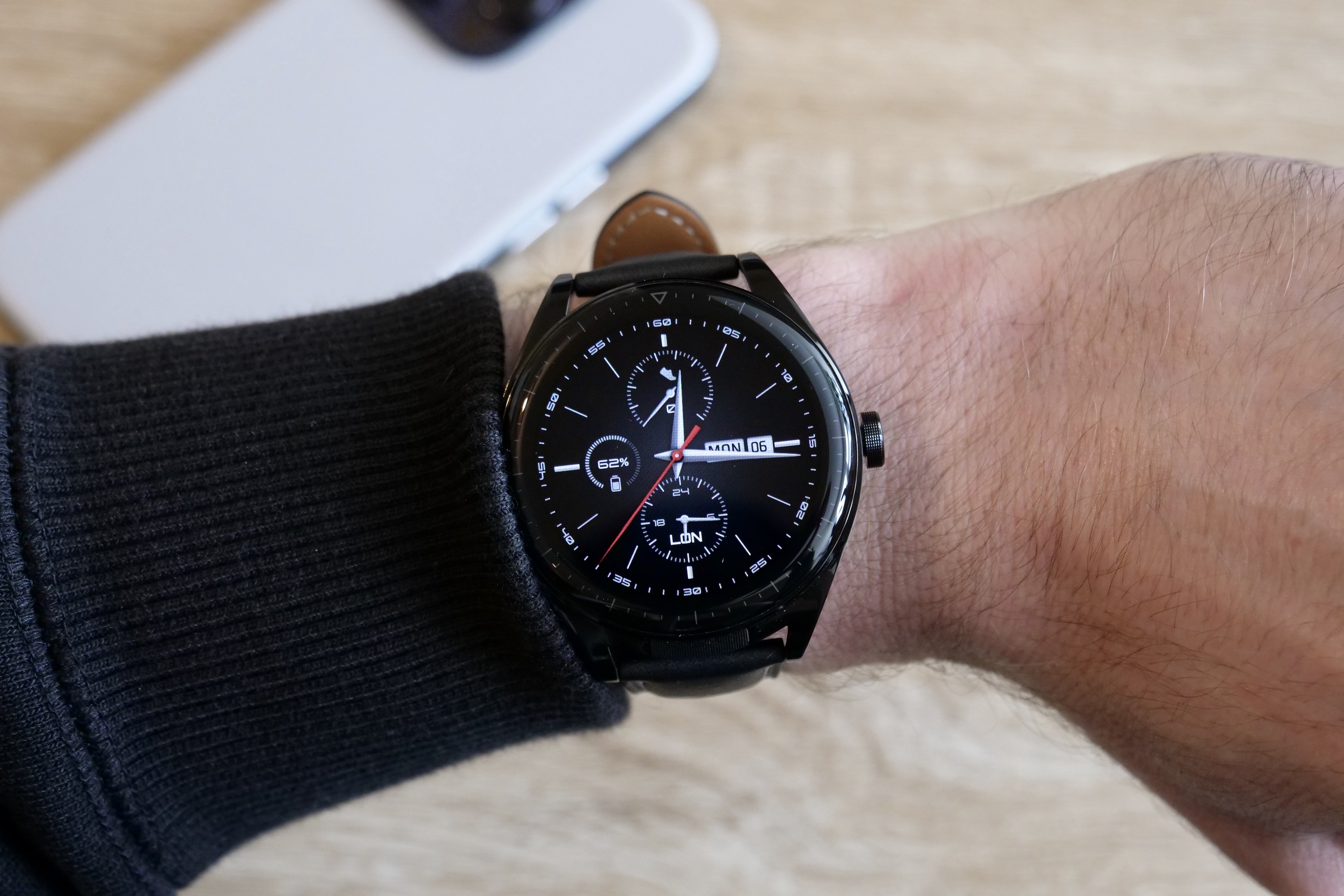 The Huawei Watch Buds on a person's wrist.