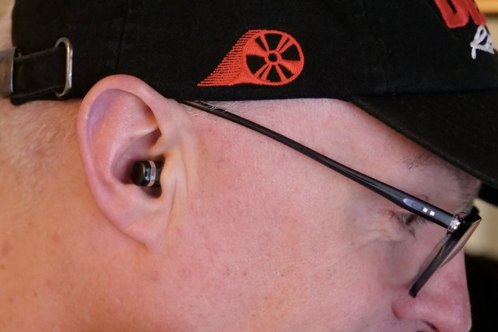 The Huawei Watch Buds's earbuds in a person's ear.
