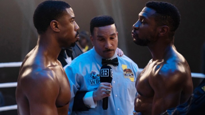 Michael B. Jordan and Jonathan Majors face each other in a boxing ring in Creed 3.