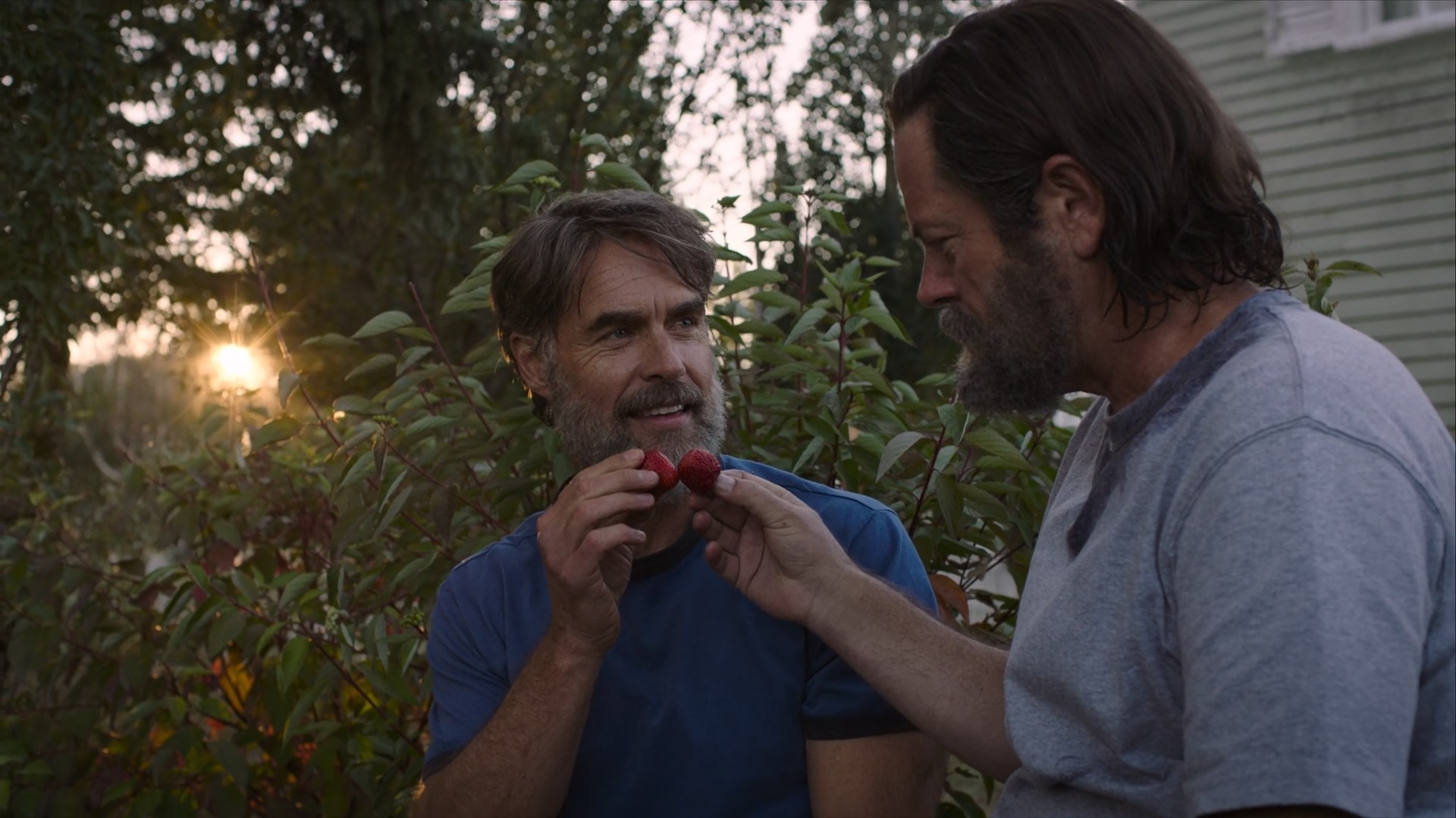 Bill and Frank "toasting" with strawberries in The Last of Us.