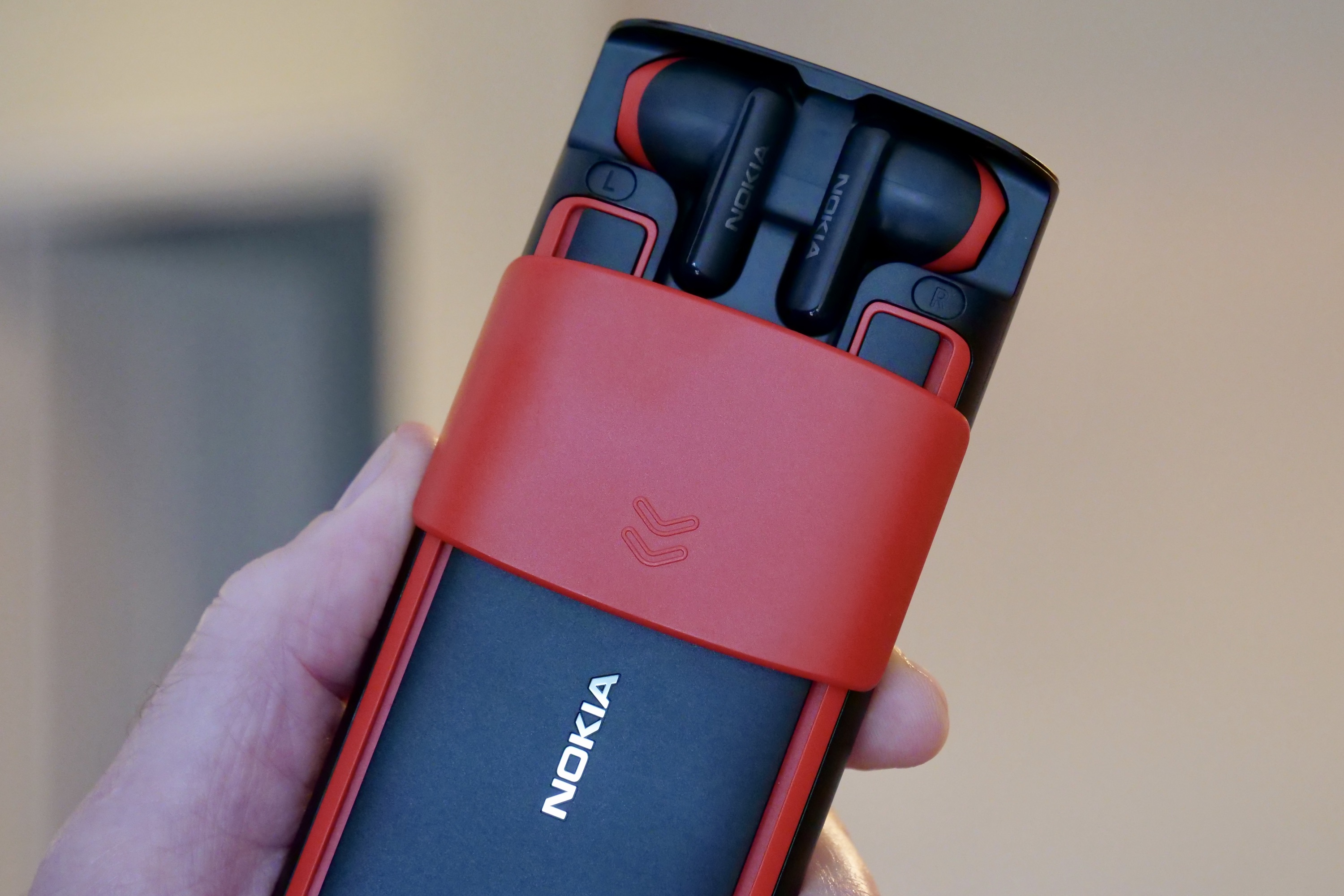 The open earbuds compartment on the Nokia 5710 XpressAudio.