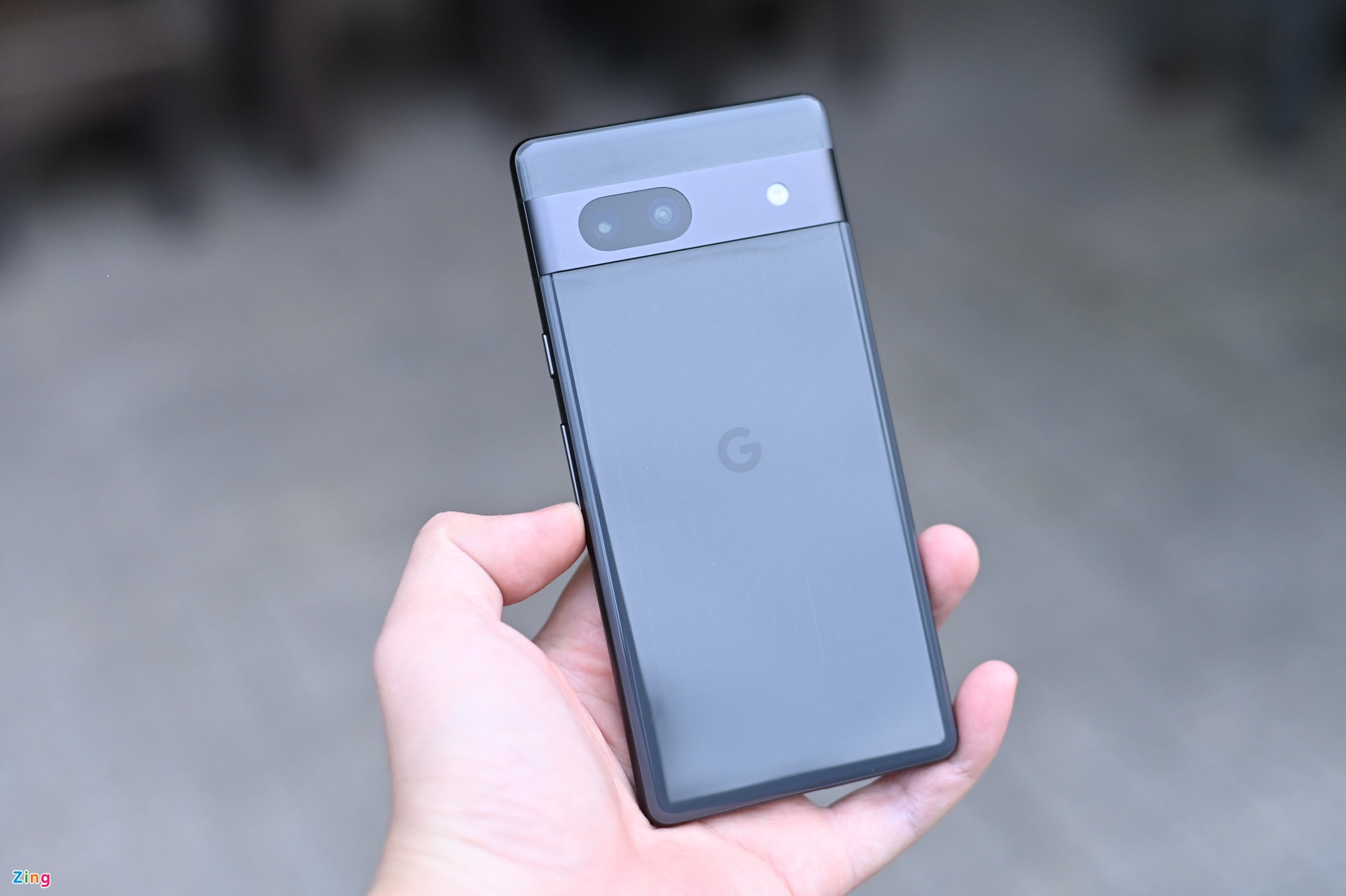 Someone holding the Google Pixel 7a.