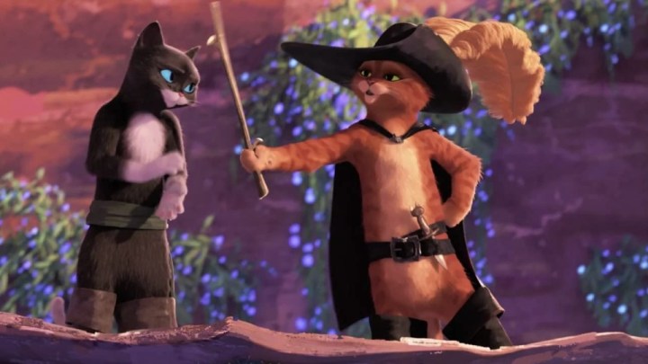 A cat points a bat at another cat in Puss in Boots: The Last Wish.