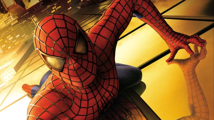 Spider-Man crawling on the side of a skyscraper in a poster for "Spider-Man" (2002).