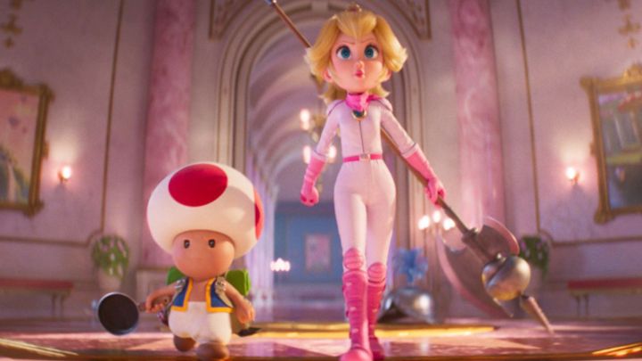 Toad and Peach walking inside a castle in in The Super Mario Bros. Movie.