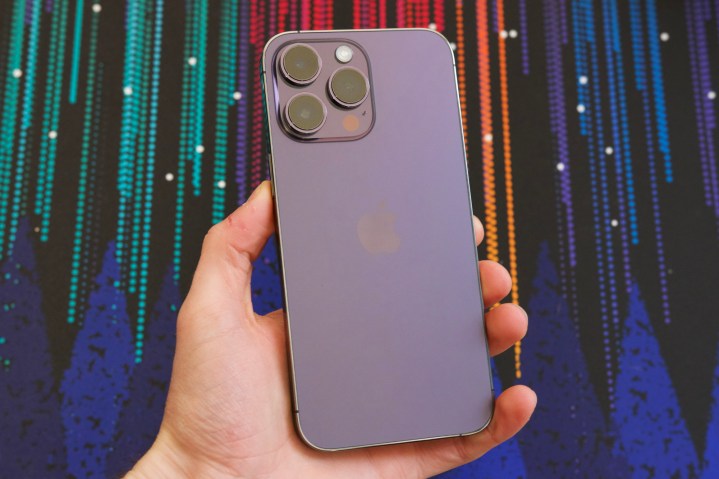 Someone holding a purple iPhone 14 Pro Max.