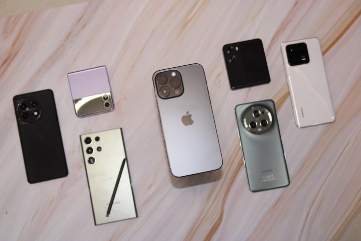 The iPhone 14 Pro Max is surrounded by other flagship phones.