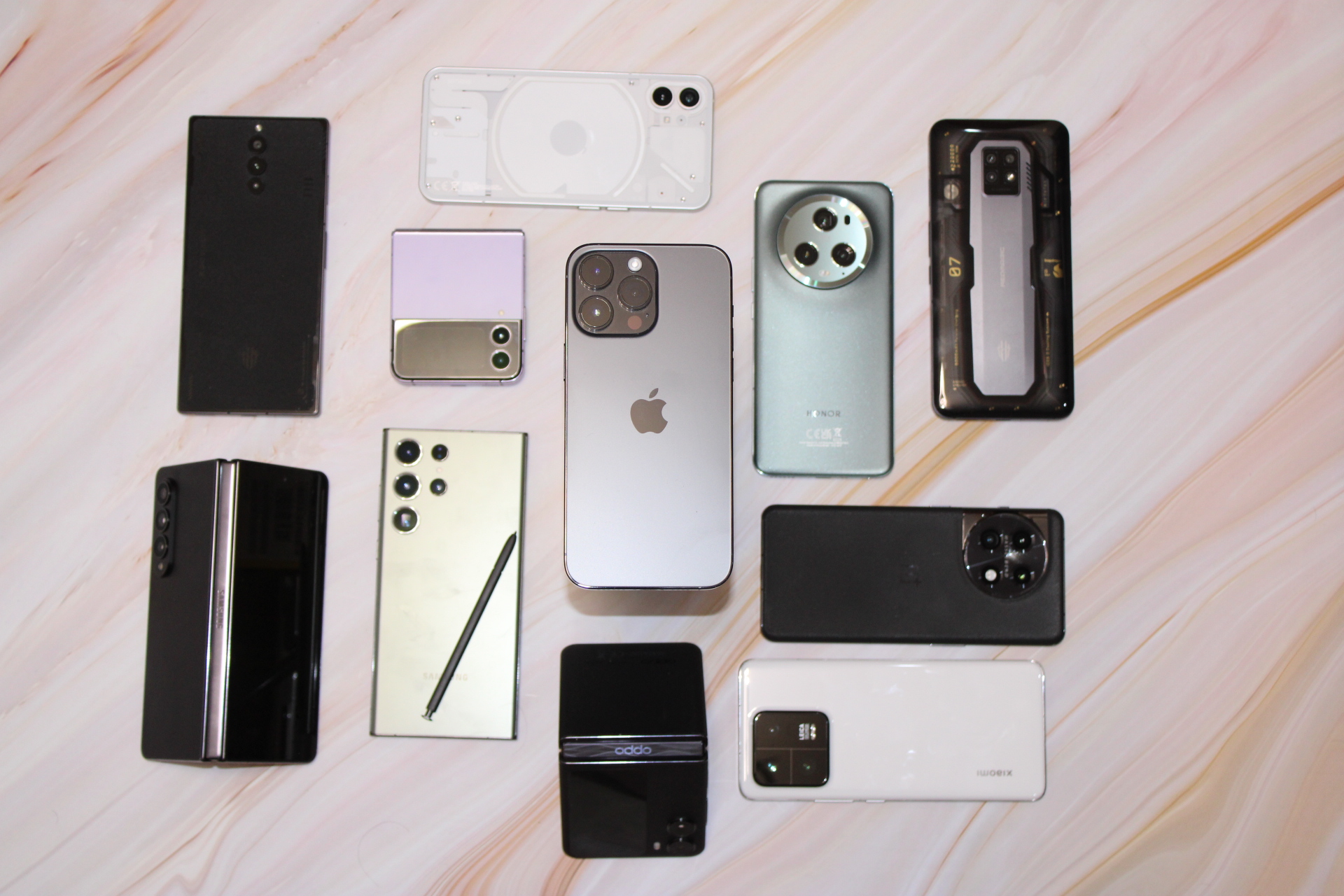 iPhone 14 Pro Max surrounded by flagship phones.