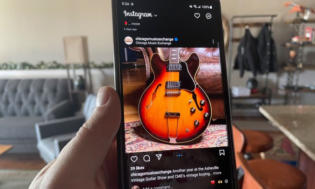 A Galaxy S23 Ultra running Instagram. On the screen, there's an orange guitar.