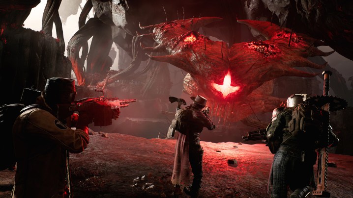 Three characters shoot at a boss in Remnant 2.