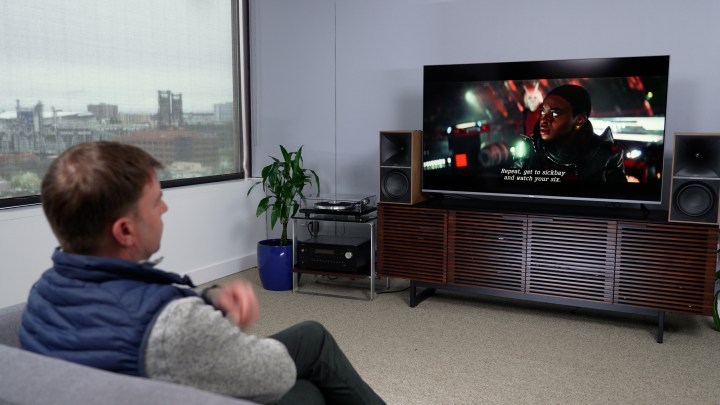 A man watches a program on a Roku. Plus Series TV. 