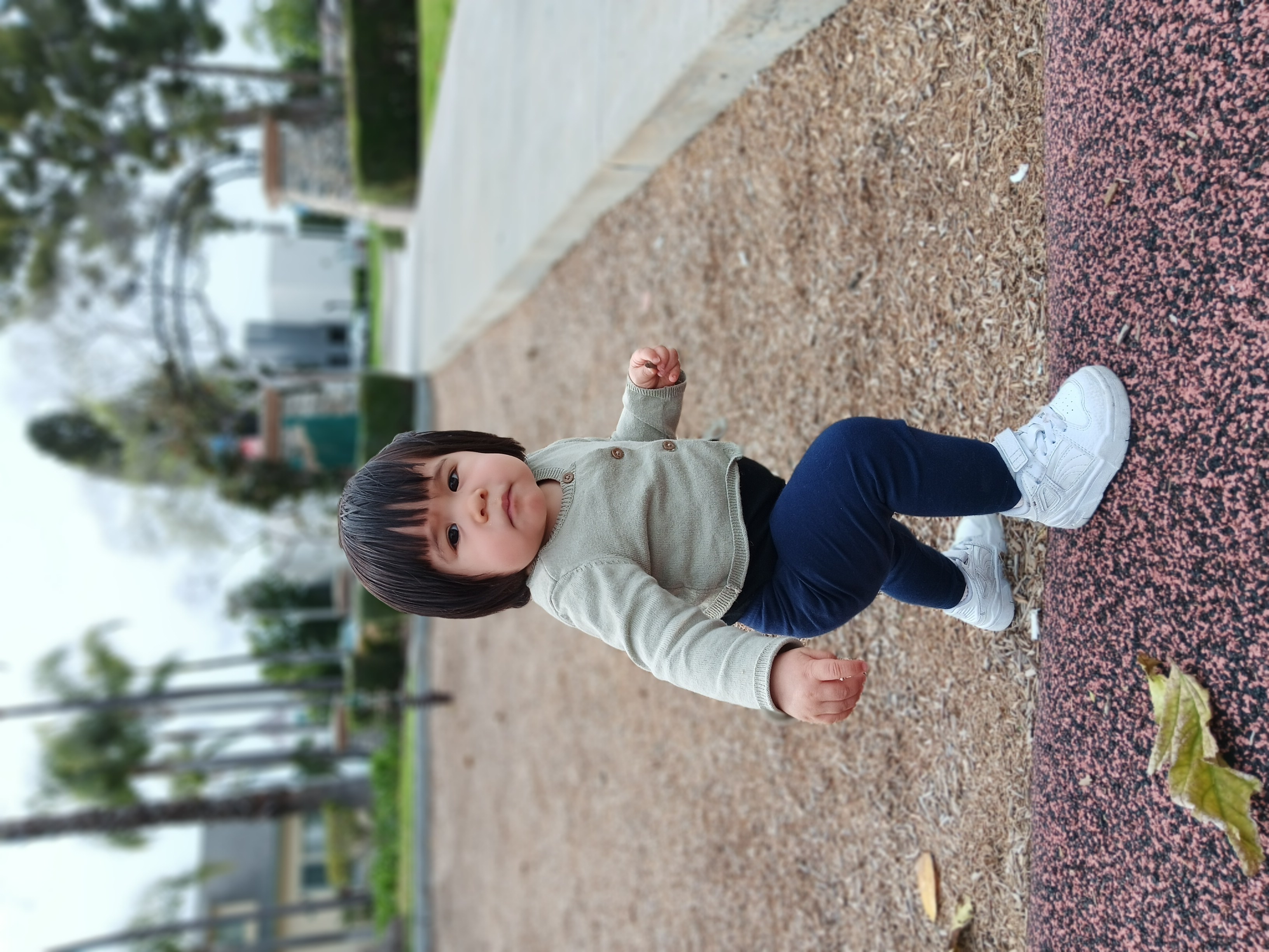 Toddler taking a step on a playground in portrait mode with Samsung Galaxy A14 5G