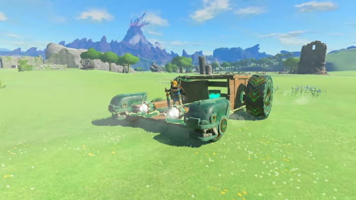 Link rides a vehicle he constructed in The Legend of Zelda: Tears of the Kingdom.