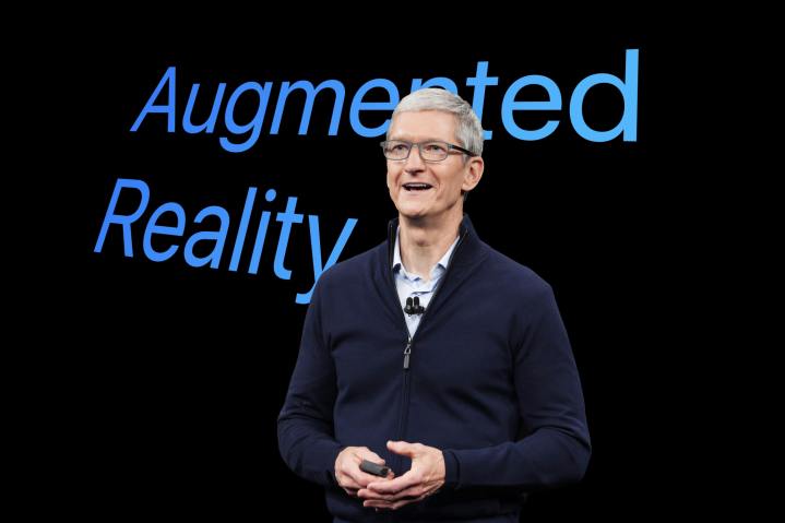 Apple CEO Tim Cook is superimposed over the the words augmented reality.