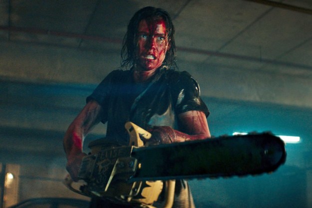 A woman wields a chainsaw in Evil Dead Rise.