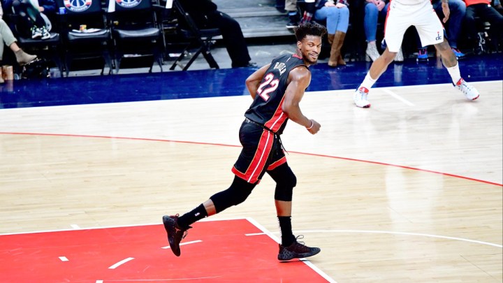 Jimmy Butler jogs up the court and smirks.