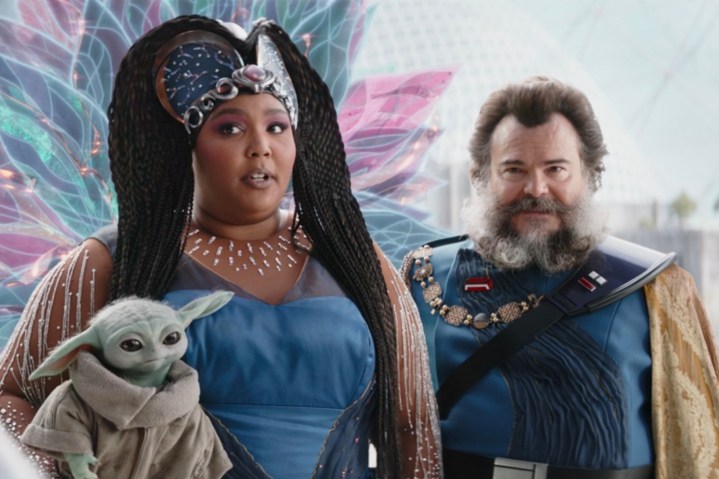 Lizzo holds Baby Yoda while standing next to Jack Black in The Mandalorian season 3 episode 6.