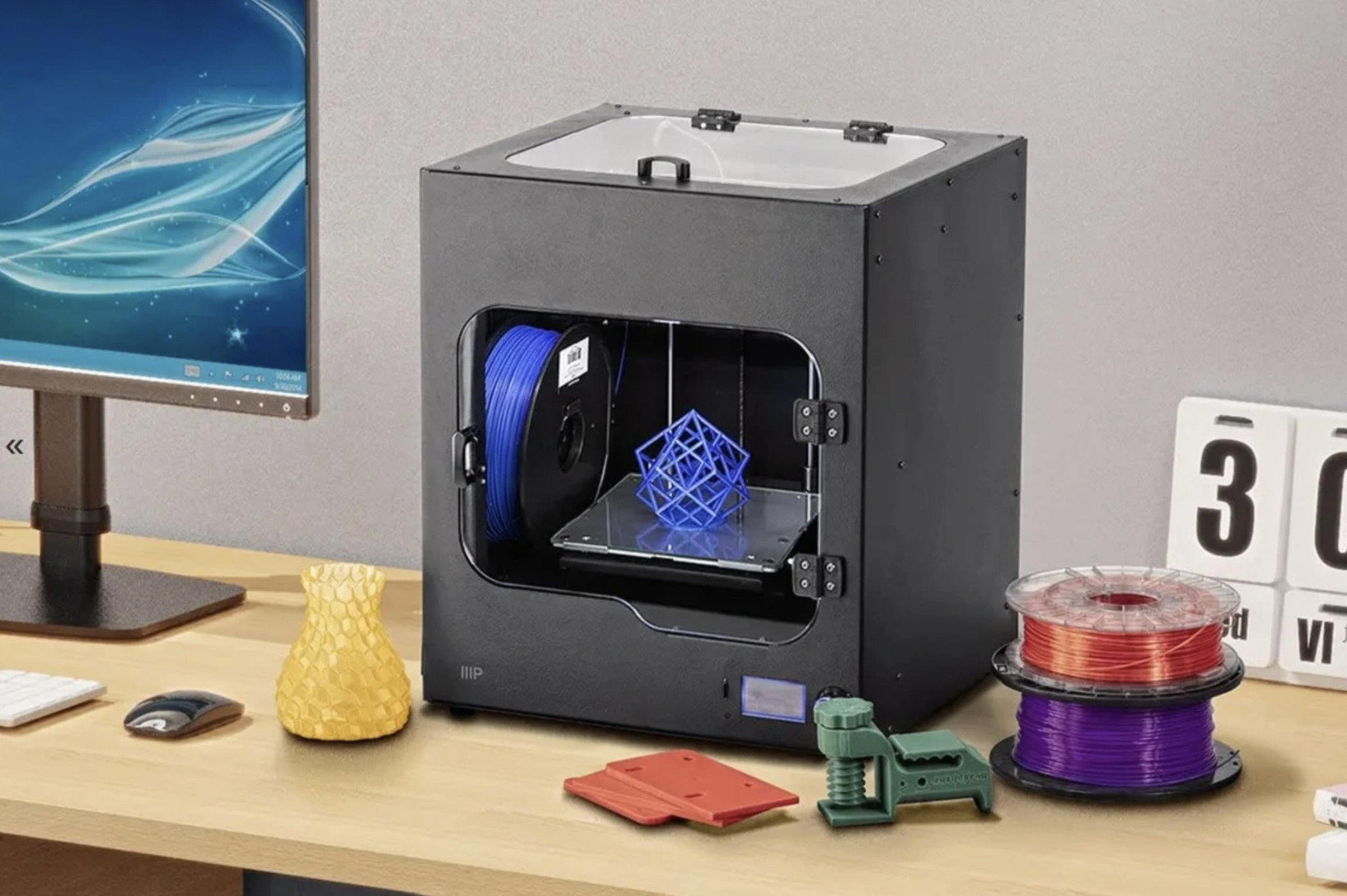 The Monoprice Maker Ultimate 2 3D Printer placed on a desktop.