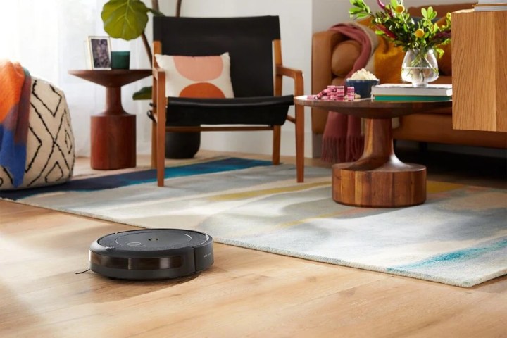 The iRobot Roomba i4 cleaning the floor.