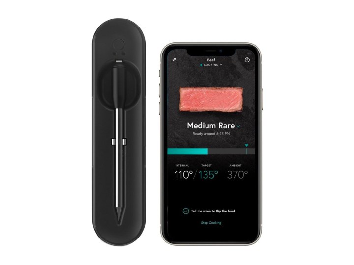 The Yummly smart meat thermometer against a white background alongside a smartphone using the Yummly app.
