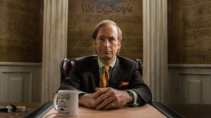 Jimmy sits at a desk in Better Call Saul.