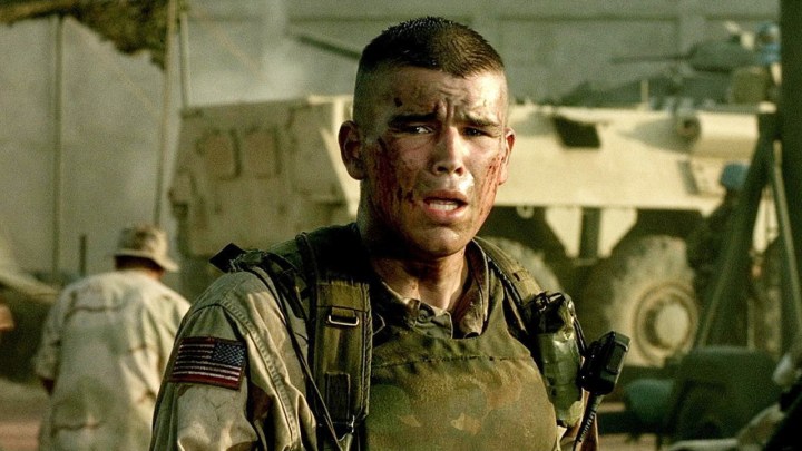 A man winces in battle in Black Hawk Down.