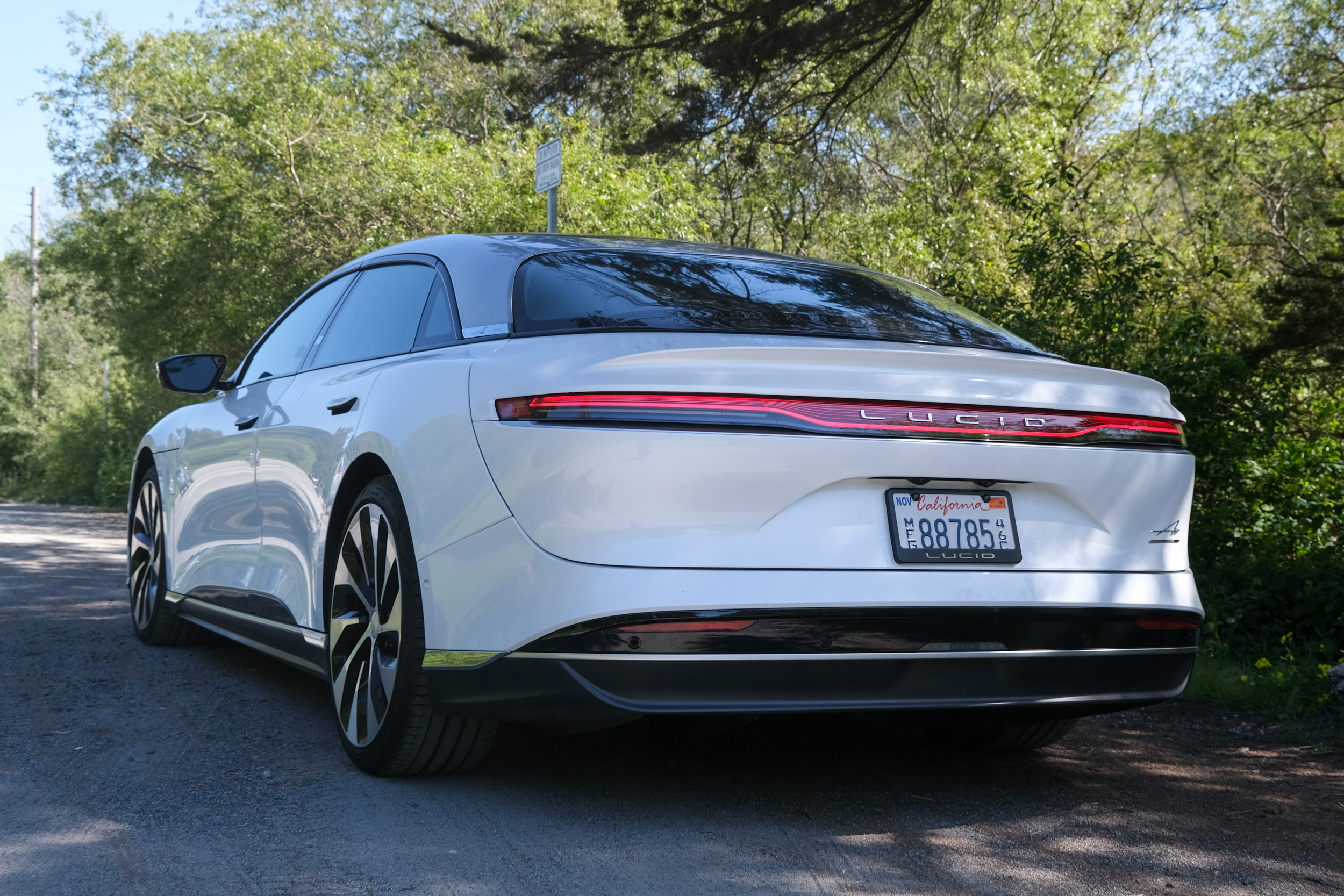 View of the rear of a Lucid Air Grand Touring in white. 
