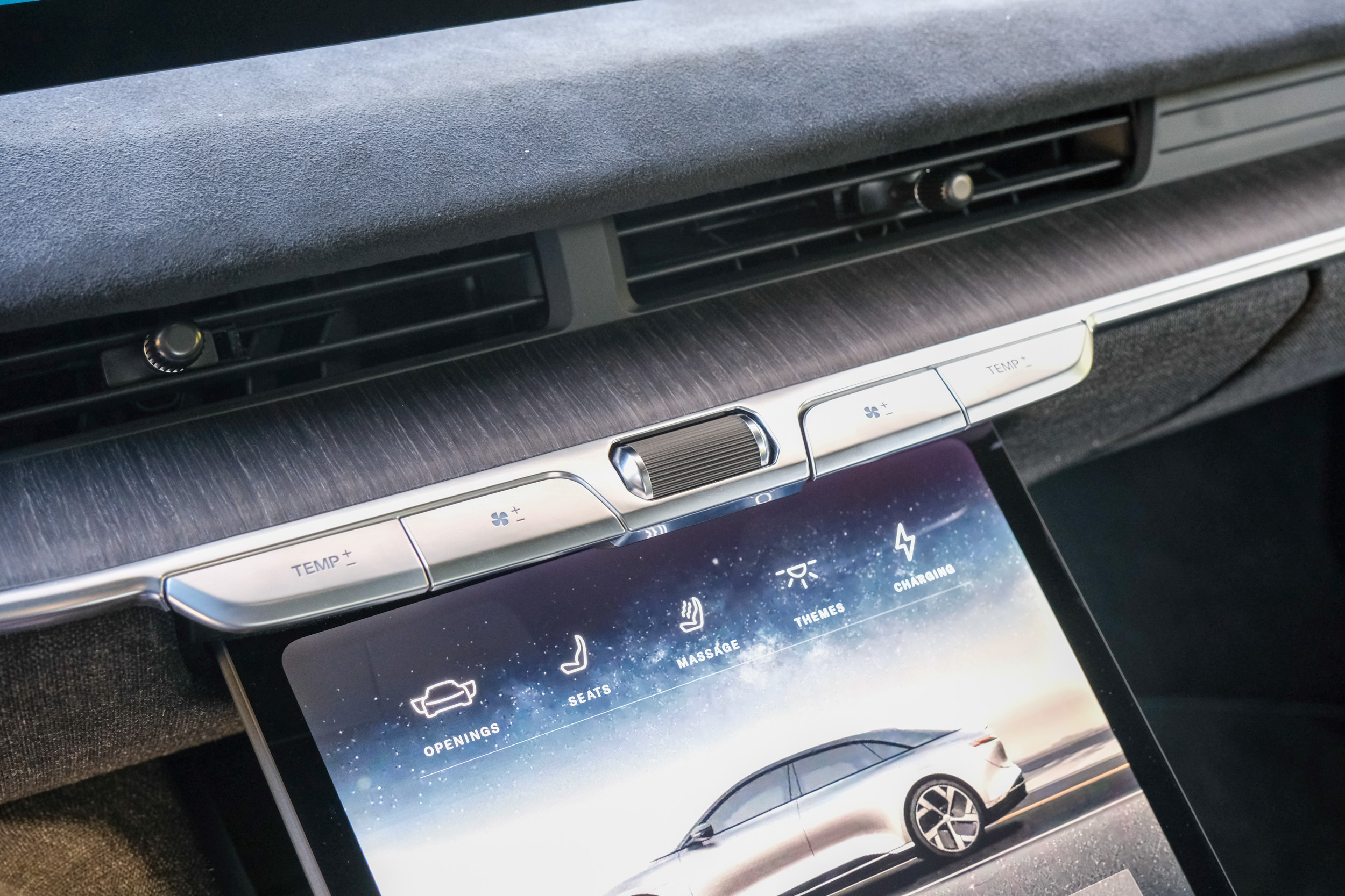 A close up of manual and touch controls on a Lucid Air infotainment panel. 