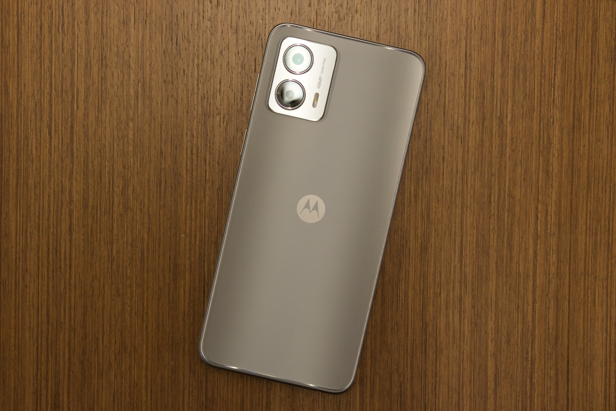 The Moto G 5G laying on a desk.