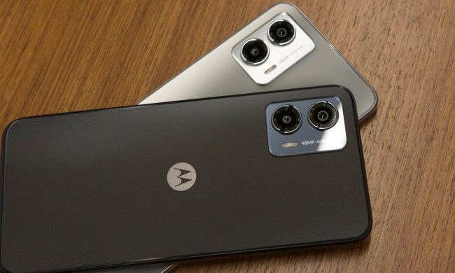 Two Moto G 5G 2023 smartphones lying on top of each other.