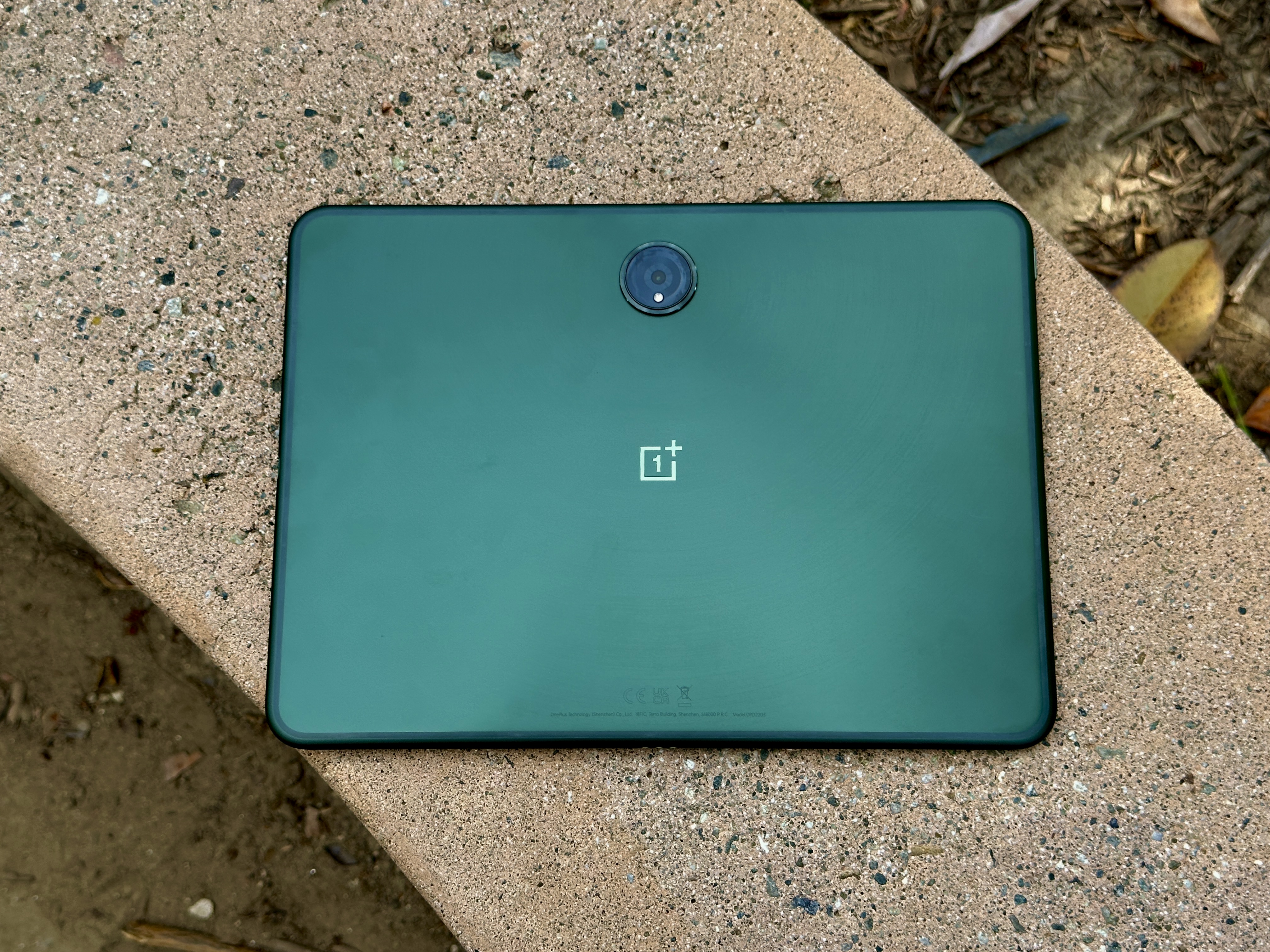 OnePlus Pad on a concrete bench
