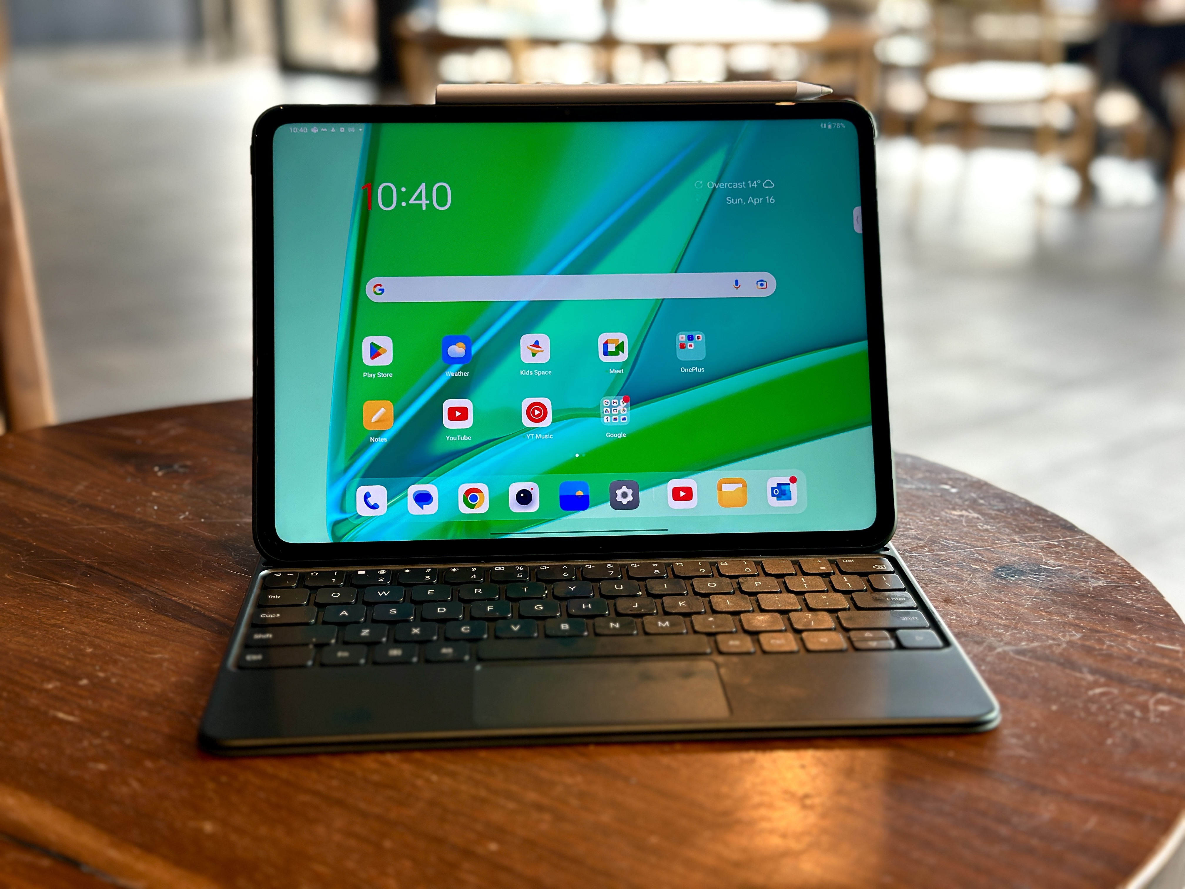 OnePlus Pad in keyboard case open on cafe table
