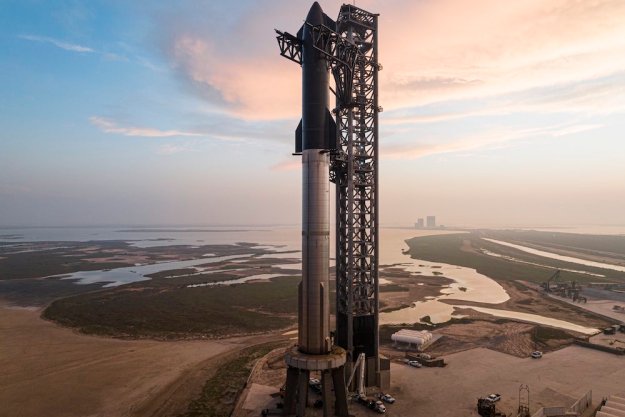 The Starship, comprising the first-stage Super Heavy and the upper-stage Starship spacecraft, on the launchpad at SpaceX's facility in Boca Chica, Texas.