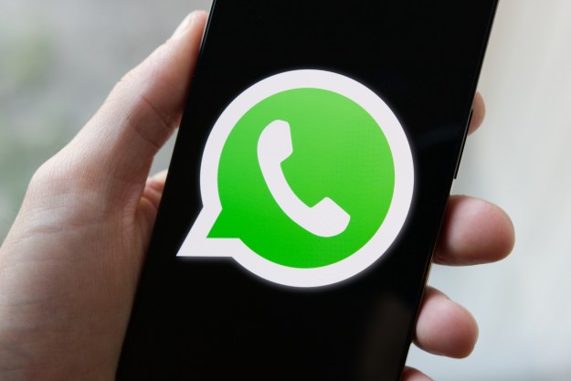WhatsApp logo on a phone.