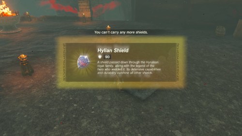 Link picking up the hylian shield.