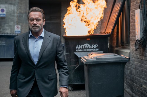 Arnold Schwarzenegger walks away from a trash fire in FUBAR.
