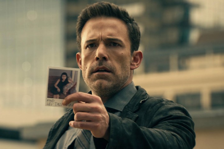 Ben Affleck holds up a photograph in Hypnotic.