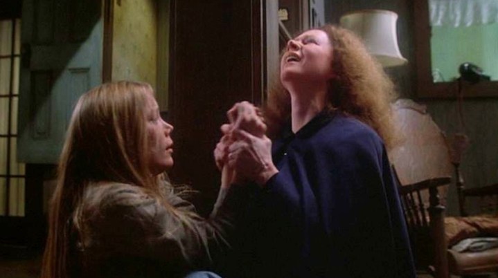 A daughter is held by her mom in Carrie.