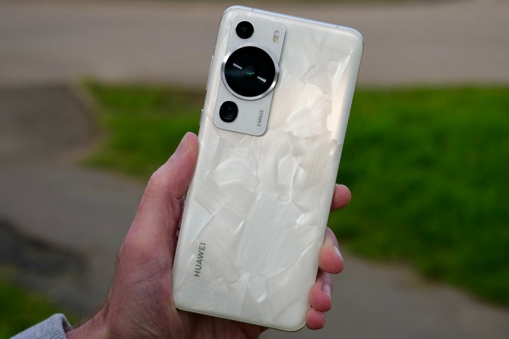 The Huawei P60 Pro held in a person's hand.