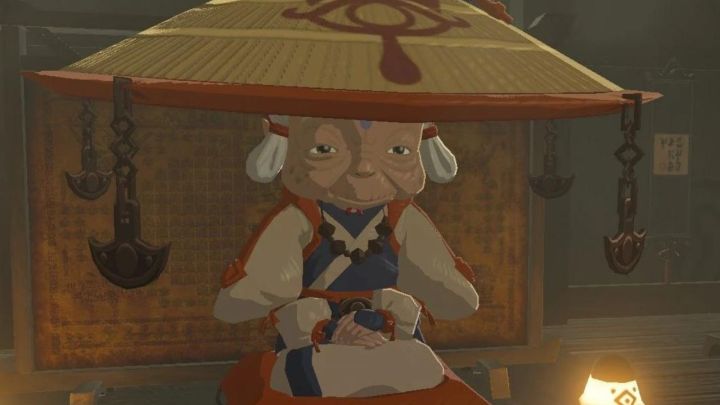 Impa kneeling down and resting her hands on her lap in The Legend of Zelda: Breath of the Wild.