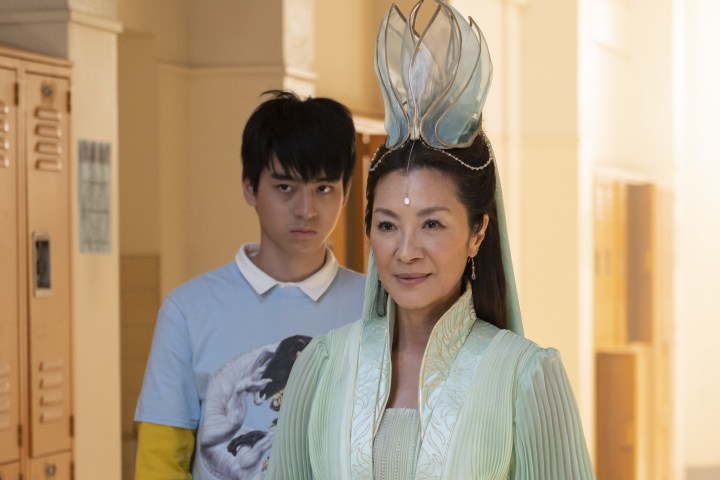 Jim Liu and Michelle Yeoh stand in a school hallway in American Born Chinese.