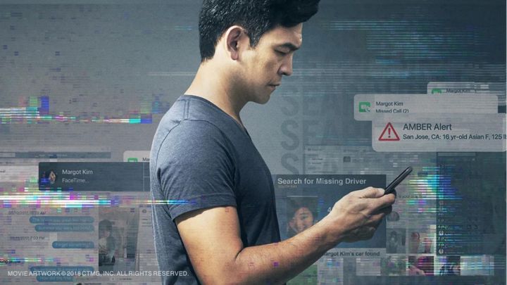 John Cho looking at a phone in a poster for the movie Missing.