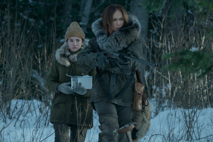 Lucy Paez and Jennifer Lopez walk through snow together in The Mother.