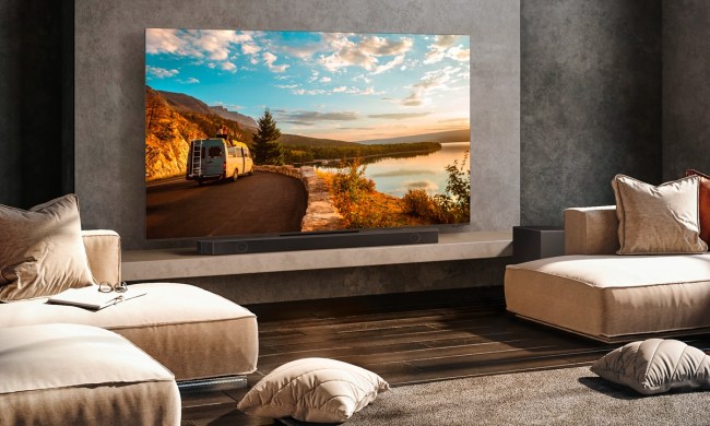 The Samsung Q-Series 11.1.4-channel surround sound system set up in a luxurious living room.