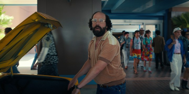 Brett Gelman stands next to the trunk of car in "Stranger Things."