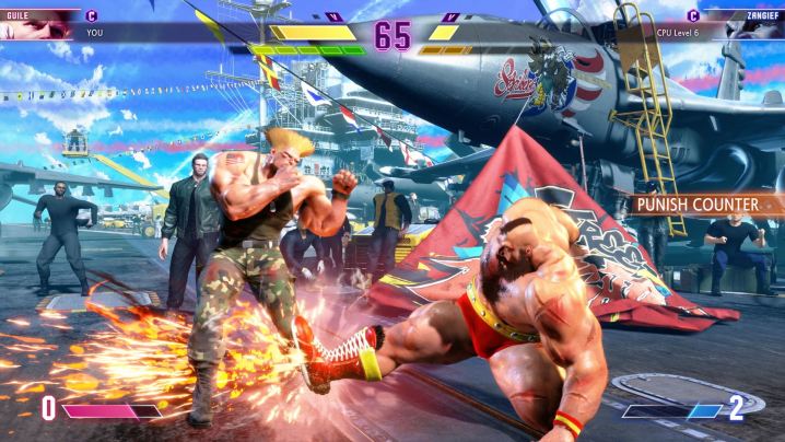 Zangief kicks Guile in Street Fighter 6.