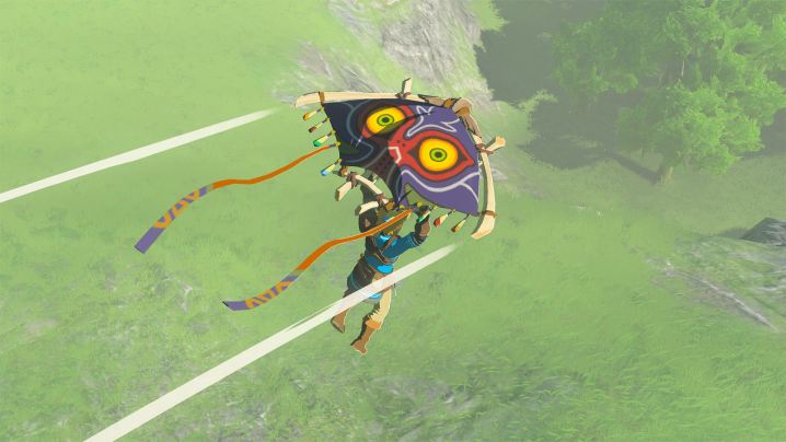 Link glides with a Majora's Mask-themed glider in Tears of the Kingdom.